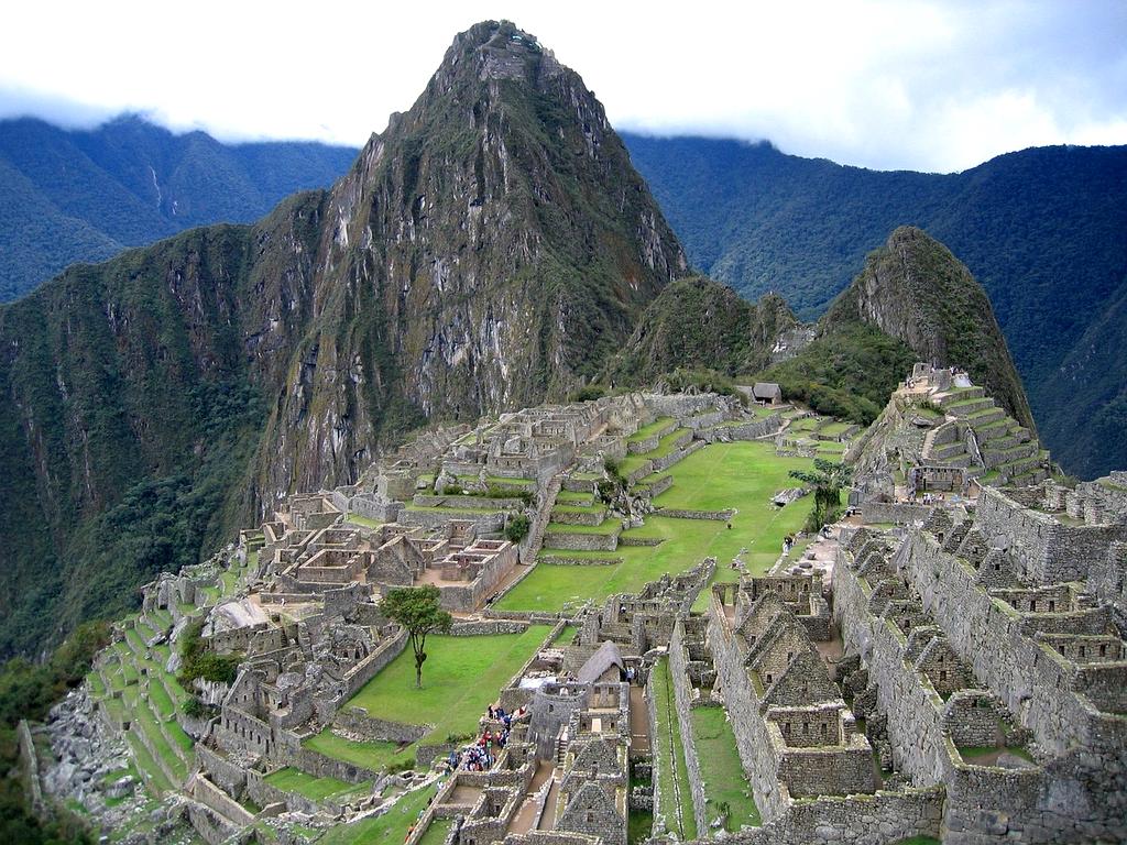 Ancient stone ruins of Machu Picchu in Peru with misty mountains